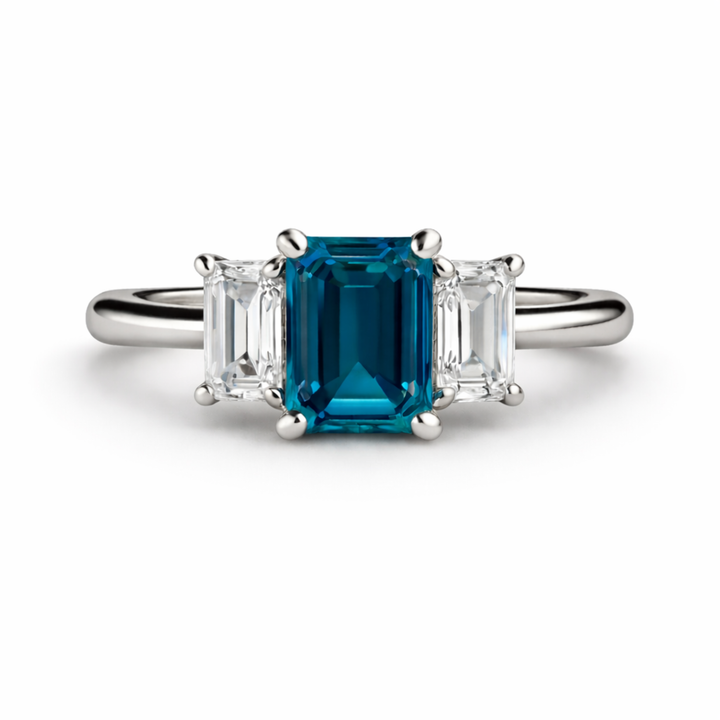Three Stone London Blue Topaz Ring With Emerald Cut Center And Lab Diamond Side Stones In White Gold | Rare Earth Jewelry