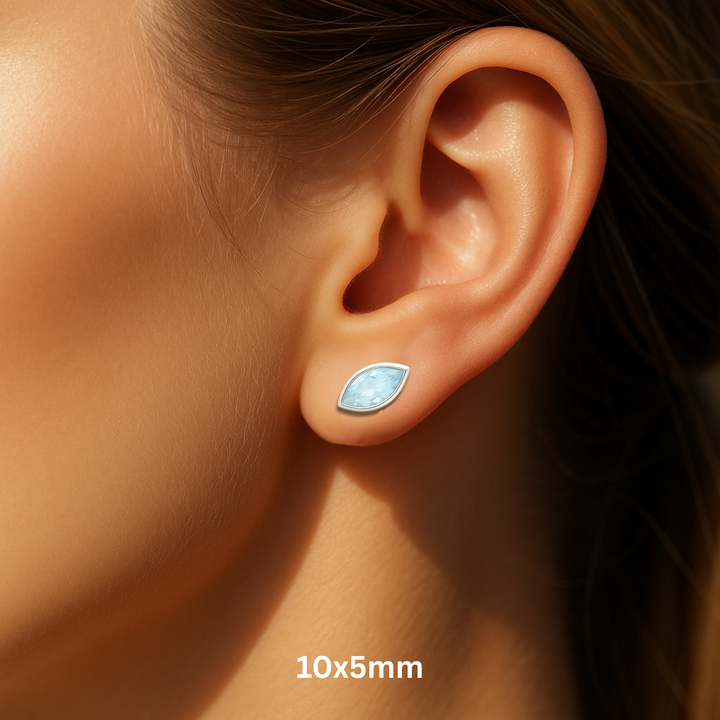 Close Up of Natural Aquamarine Stud Earrings on a Model, Modern Bezel Set 10x5mm Marquise cut studs on the Ear, March Birthstone Earrings for Men or Women | Rare Earth Jewelry