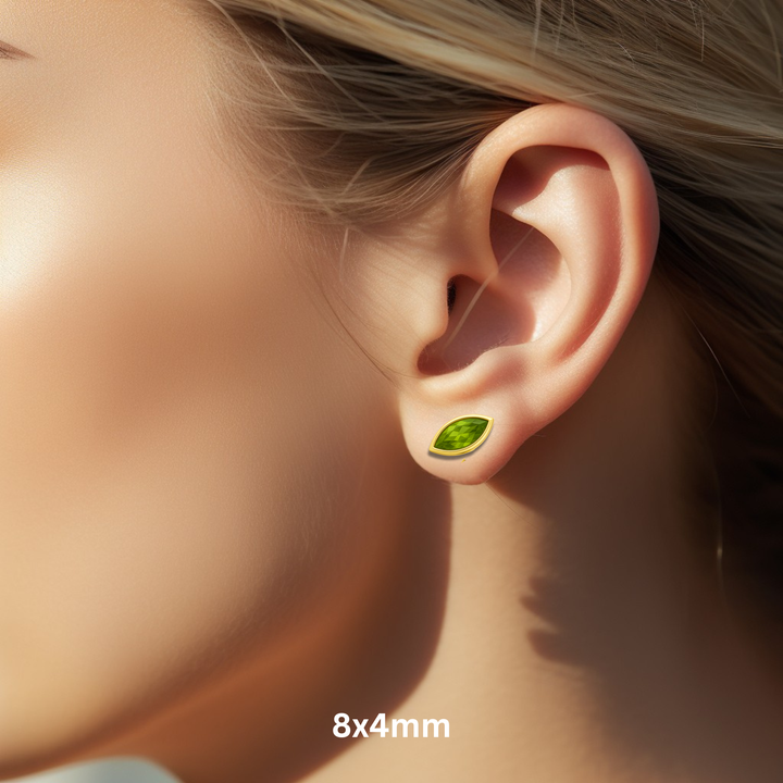 Bezel Set Peridot in 14K Gold, 8x4mm Marquise Cut Peridot Studs Shown on Ear Model, Solid 14K Gold Bezel Set Design for Men or Women, Natural Gemstone Earrings, August Birthday Gift | Rare Earth Jewelry
