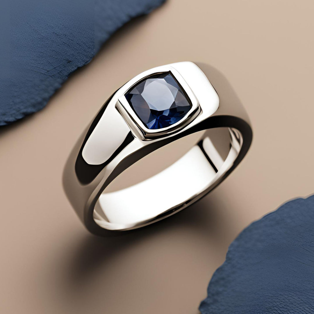 Men's cushion cut blue sapphire ring in a modern bezel set design from Rare Earth Jewelry.