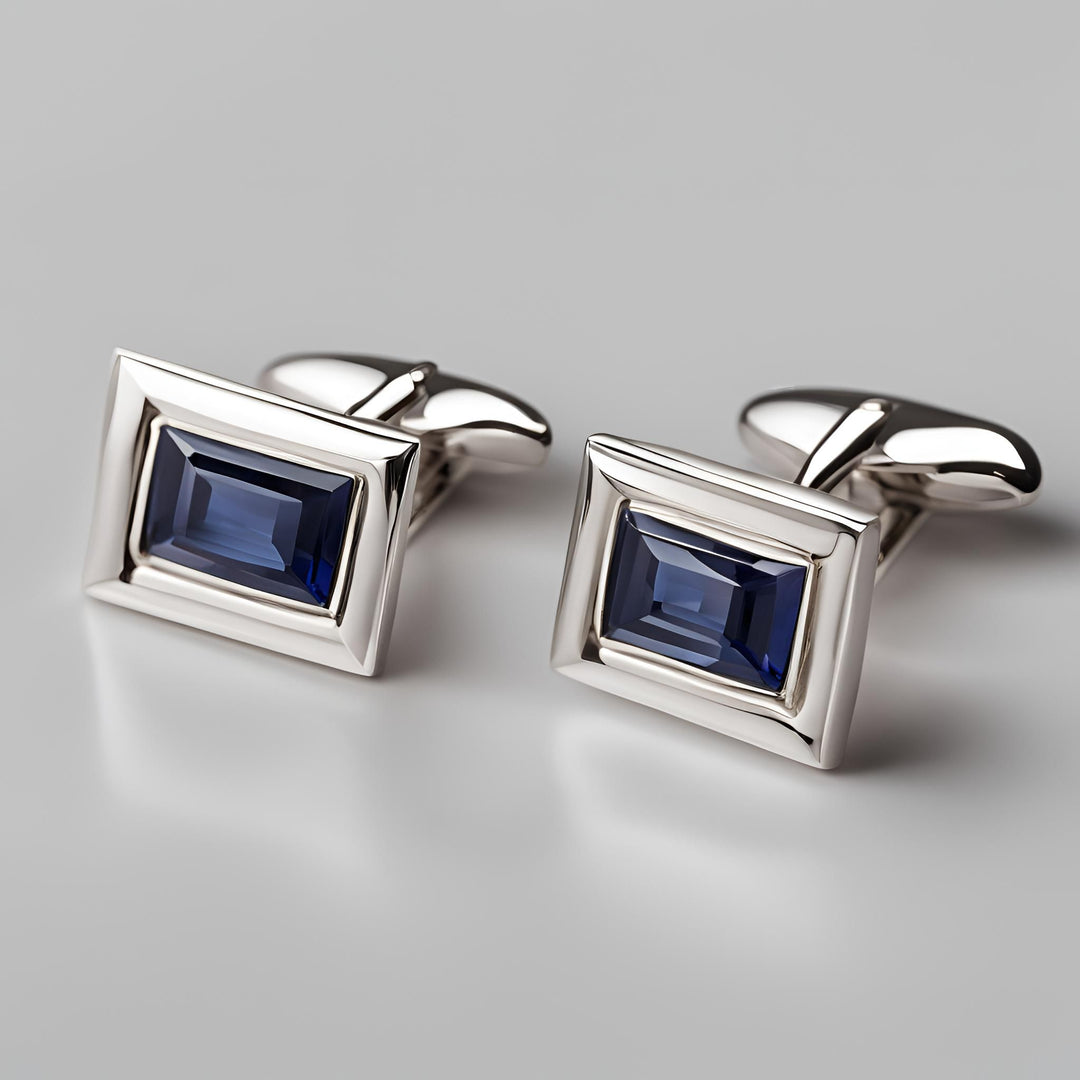 Men's rectangular cufflinks in 14K Gold with Blue Sapphire baguettes from Rare Earth Jewelry.