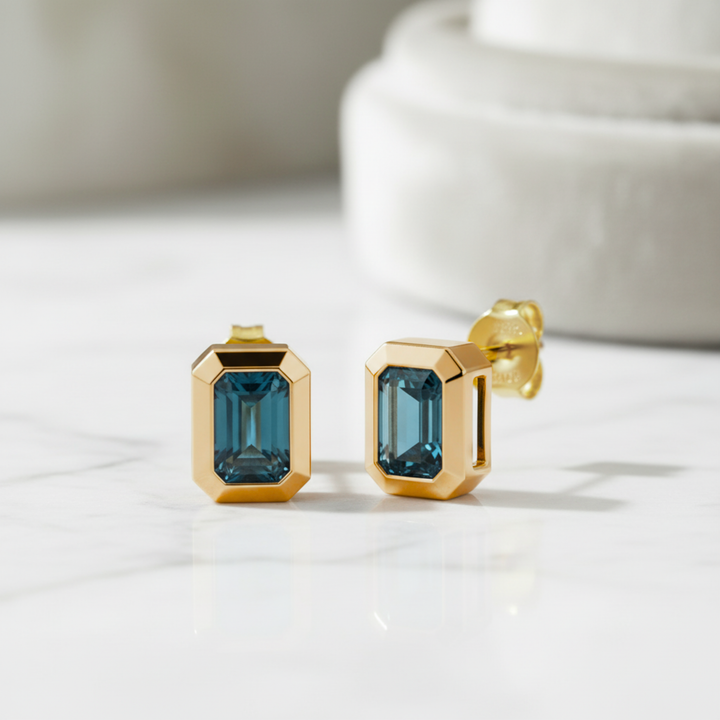 Minimalist London Blue Topaz stud earrings in 14K gold, modern gemstone jewelry for everyday wear | Rare Earth Jewelry