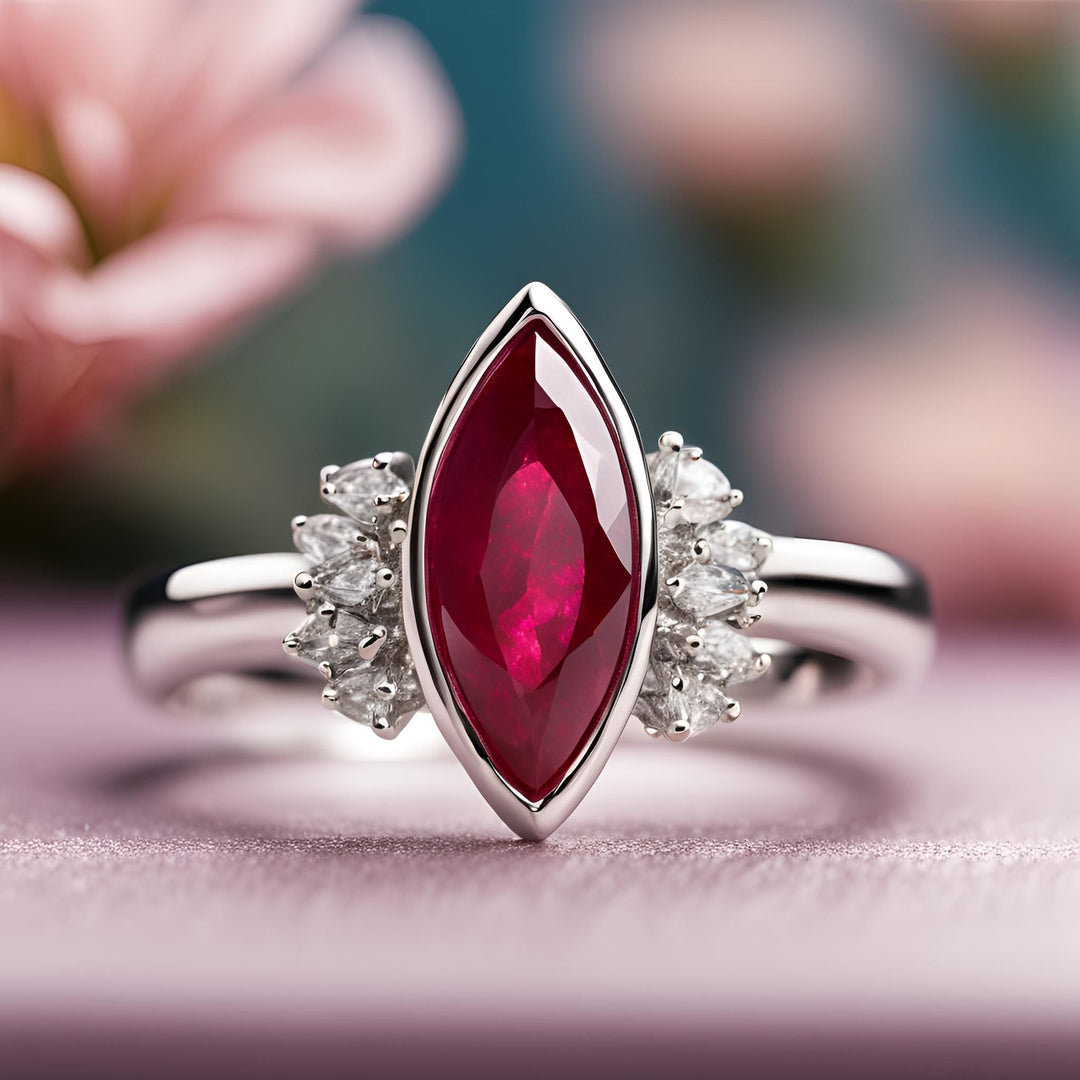 A marquise cut ruby engagement ring with diamond accents and a modern bezel set design from Rare Earth Jewelry.