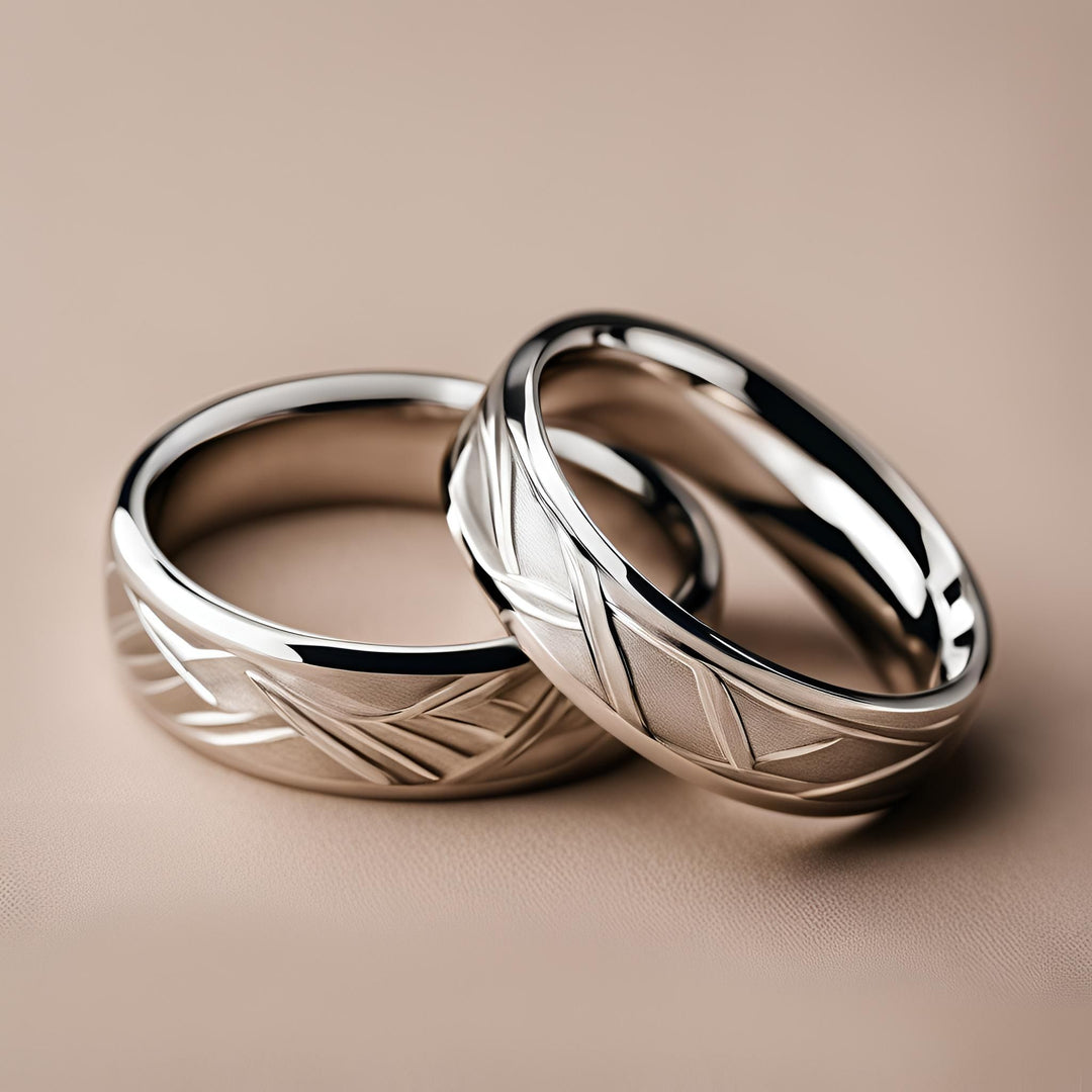 A pair of modern wedding rings with a criss-cross design in gold or platinum from Rare Earth Jewelry.