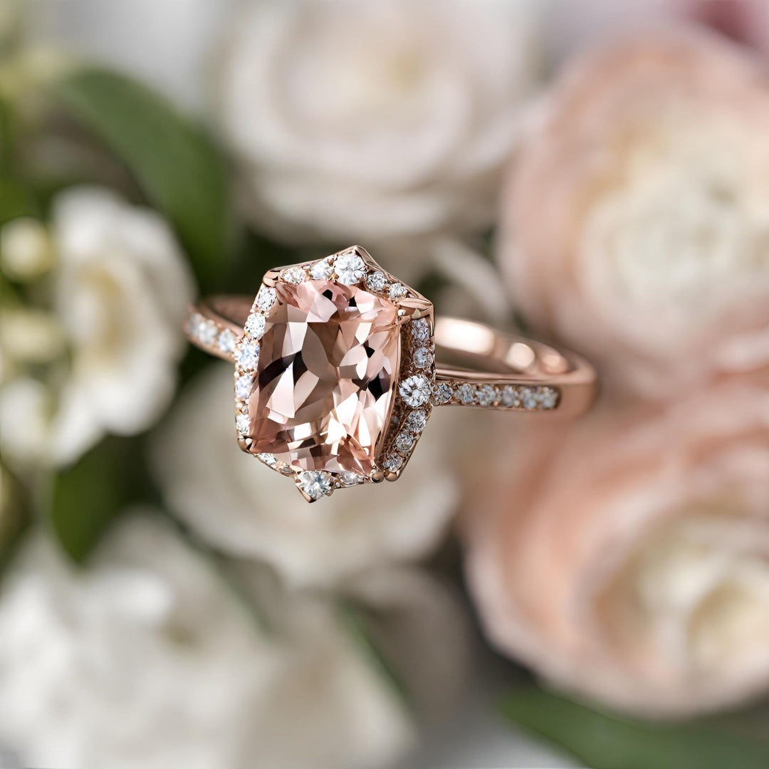 A Morganite cushion cut engagement ring with a vintage inspired diamond halo design in rose gold from Rare Earth Jewelry.