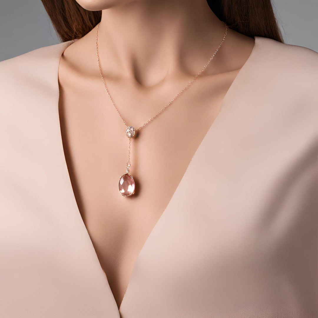 An oval natural Morganite pendant in a feminine drop necklace design from Rare Earth Jewelry.