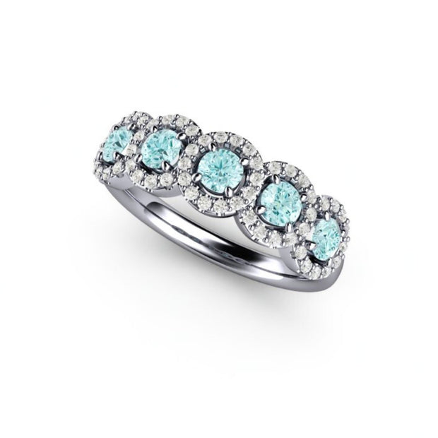 Natural Aquamarine and diamond halo ring in Platinum.