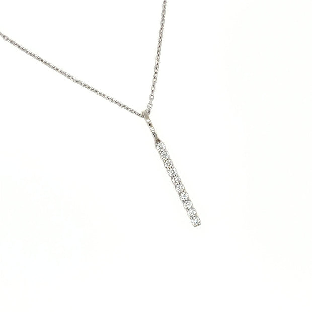 Natural diamond vertical bar style necklace with 1 inch long diamond pendant and adjustable chain.