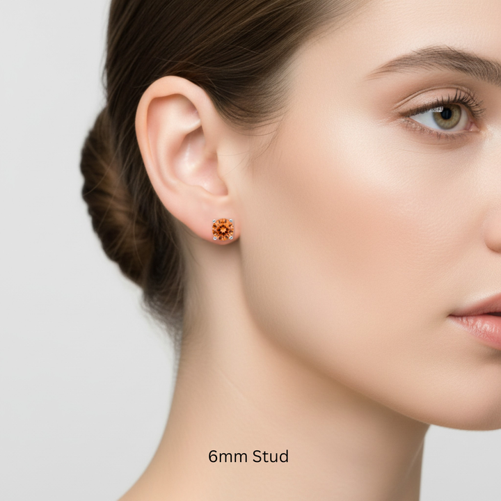 6mm natural orange topaz stud earring on female model, round sunrise topaz in 14k gold, unisex earring for men or women, single or pair available | Rare Earth Jewelry