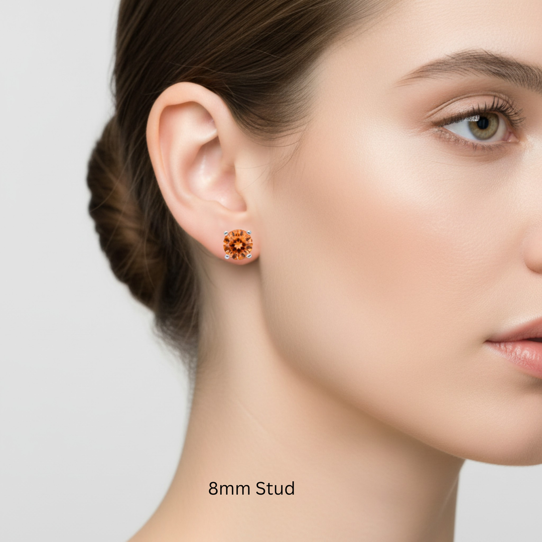 8mm natural orange topaz stud earring on female model, unisex sunrise topaz gemstone in 14k gold, single or pair available | Rare Earth Jewelry