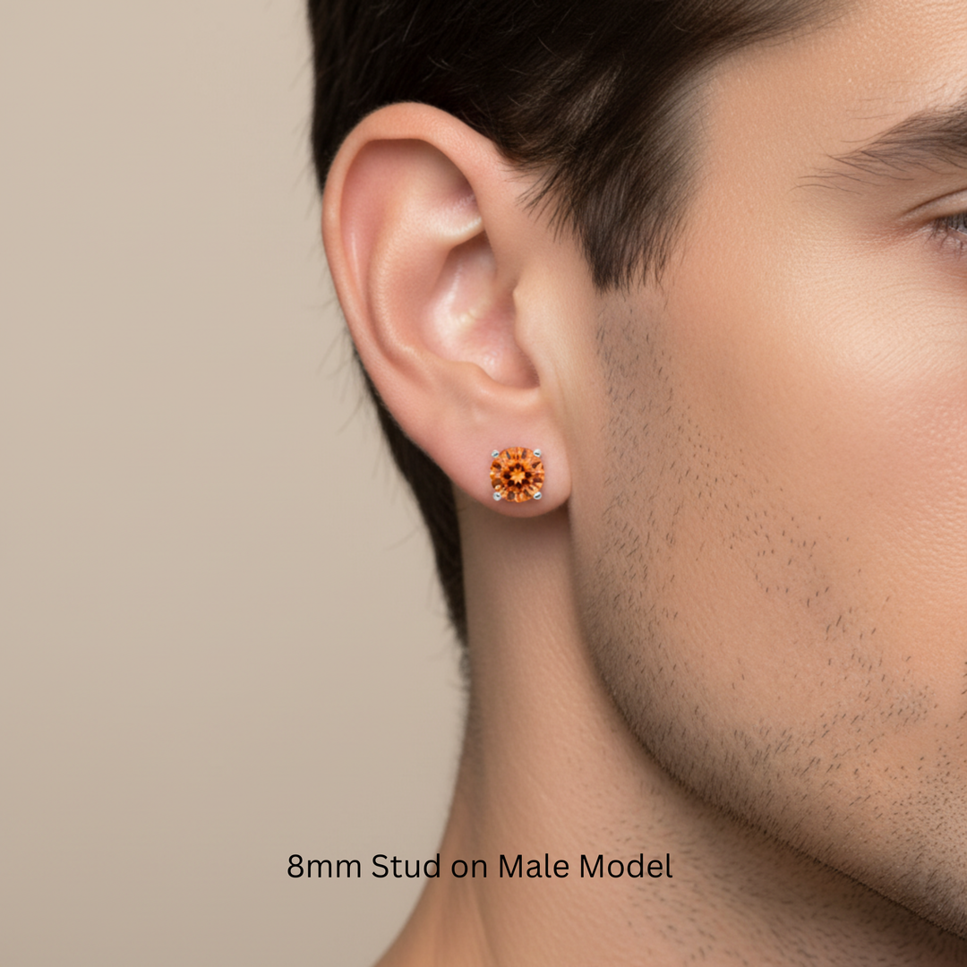 8mm natural orange topaz stud earring on male model, bold sunrise orange gemstone in 14k gold, unisex style for men and women, single or pair available | Rare Earth Jewelry