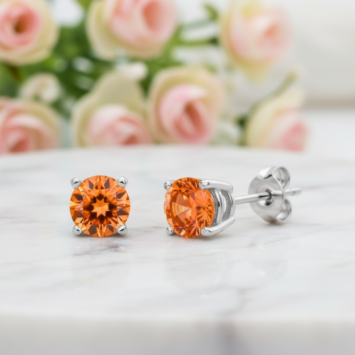 natural orange topaz stud earring in 14k white gold displaying vivid sunrise color, single earring available, unisex design for men or women | Rare Earth Jewelry