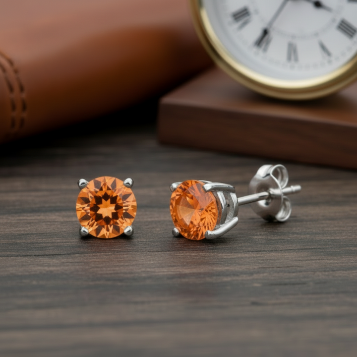 natural orange topaz stud earring in 14k white gold displaying vivid sunrise color, single earring available, unisex design for men or women | Rare Earth Jewelry