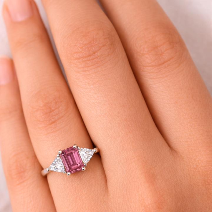 Emerald Cut Pink Tourmaline Ring shown on the Finger, Pink Tourmaline Engagement Ring, 3 Stone with Trillions | Rare Earth Jewelry