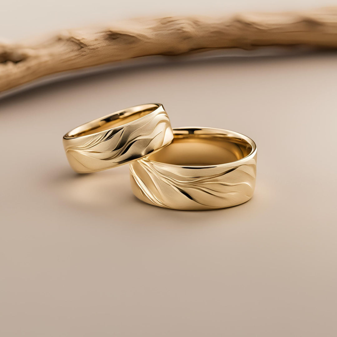 A pair of nature inspired wedding bands with a Maui mountain and valley design in 14K or 18K Gold from Rare Earth Jewelry.