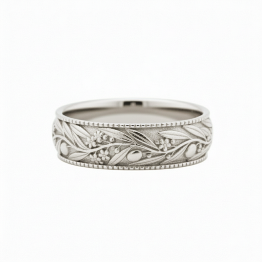 Engraved olive leaf wedding band in polished 14K white gold, botanical nature-inspired ring with flowing branch and floral details | Rare Earth Jewelry