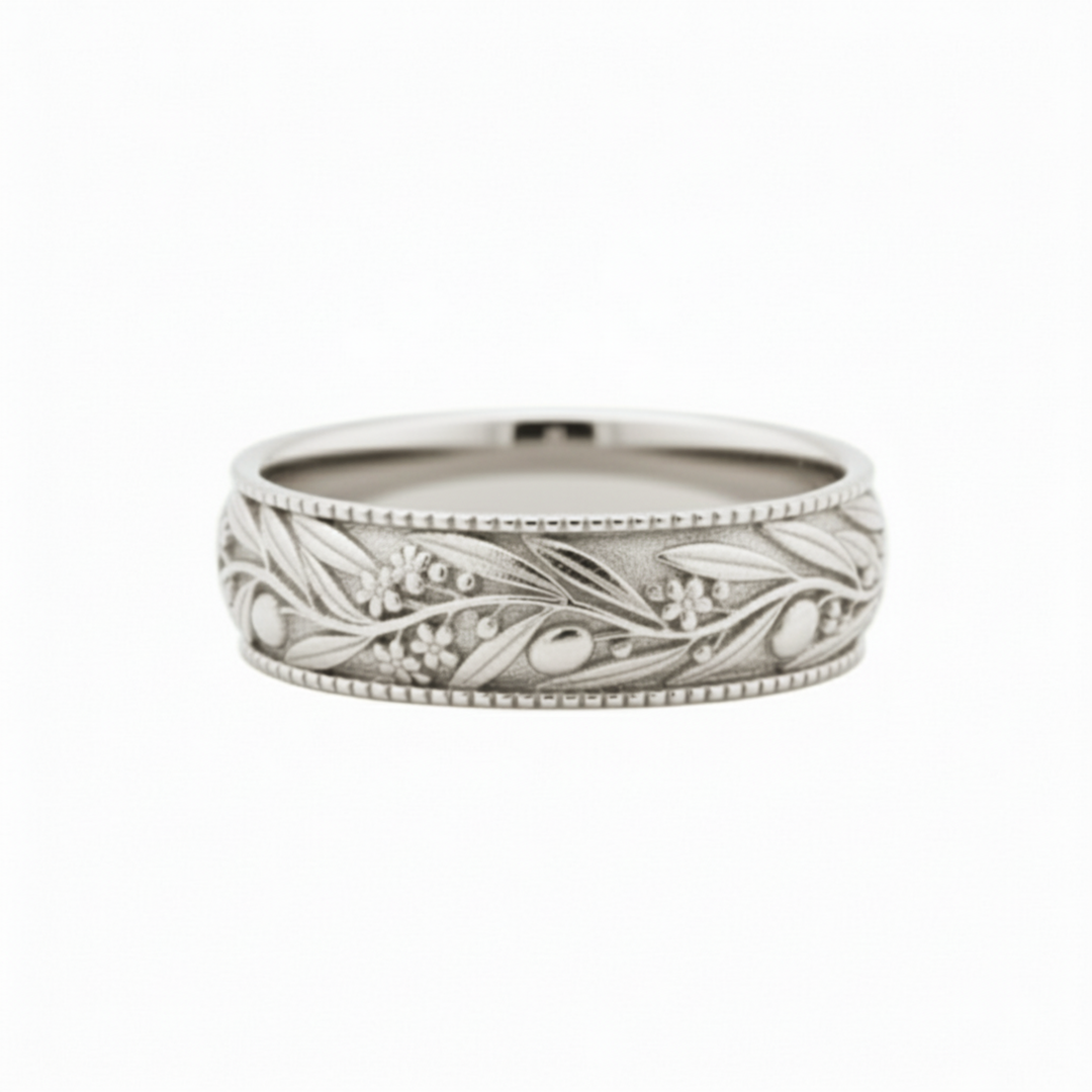 Engraved olive leaf wedding band in polished 14K white gold, botanical nature-inspired ring with flowing branch and floral details | Rare Earth Jewelry