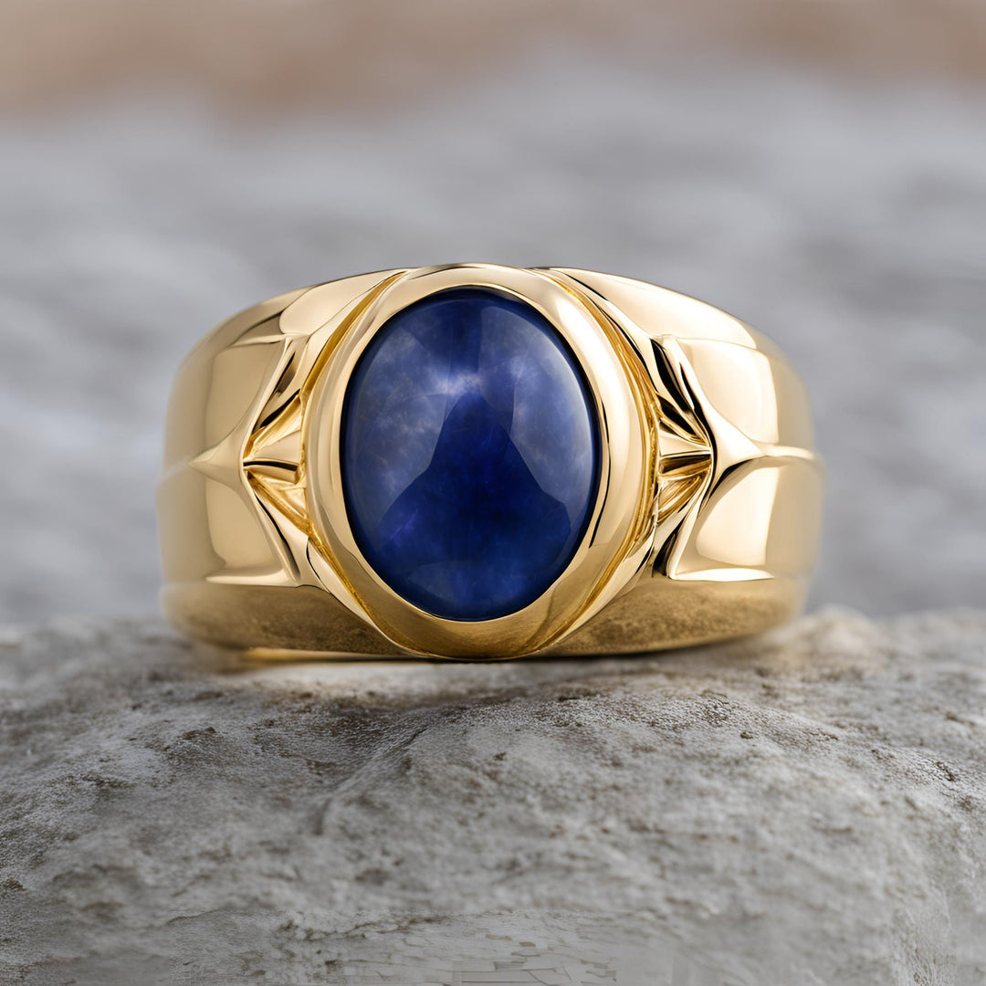 Men's oval blue sapphire ring with cabochon cut sapphire and sculpted 18K Gold design from Rare Earth Jewelry.