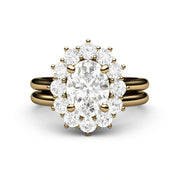Oval Charles & Colvard Forever One Moissanite bridal set in a yellow gold antique style halo design.