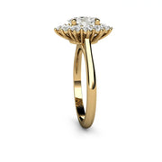 Side view of an oval moissanite ring in yellow gold