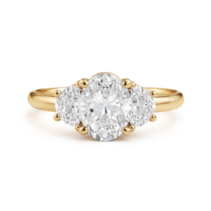 Oval Cut Moissanite Engagement Ring, 3 Stone Style with Half Moon Side Stones shown in Yellow Gold | Lab Created Engagement Ring | Rare Earth Jewelry