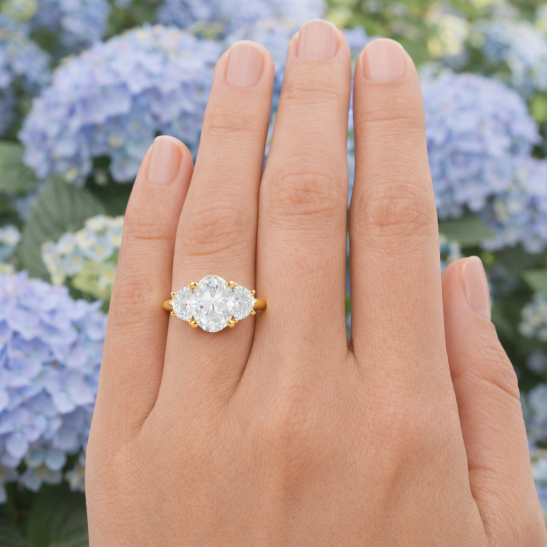 Oval Moissanite Engagement Ring with 3 Stone Design with Half Moons shown on the Finger | Rare Earth Jewelry