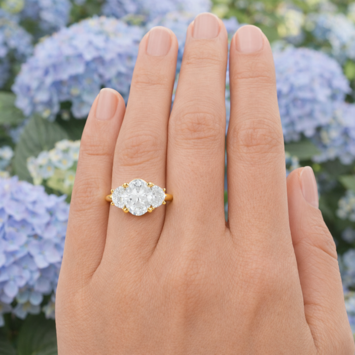 Oval Moissanite Engagement Ring with 3 Stone Design with Half Moons shown on the Finger | Rare Earth Jewelry