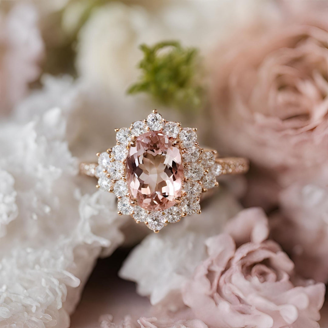 Oval Morganite engagement ring in a feminine vintage inspired diamond cluster design from Rare Earth Jewelry.