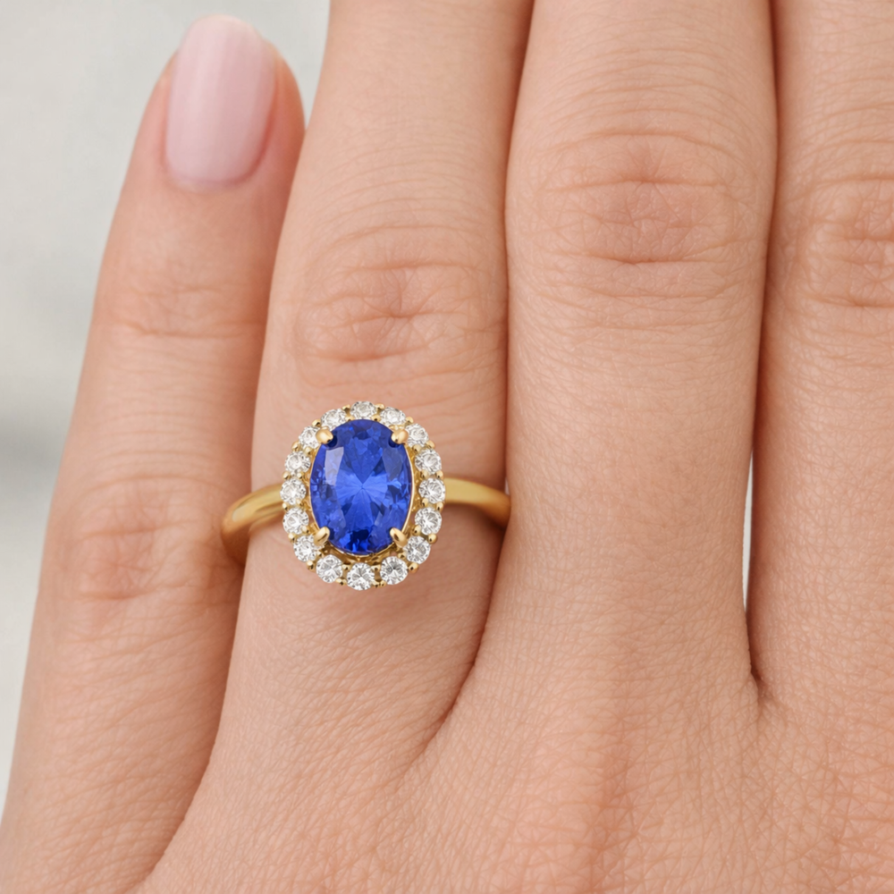 Oval Tanzanite Engagement Ring with  Diamond Halo shown on the Hand, Natural Gemstone Engagement Ring | Rare Earth Jewelry
