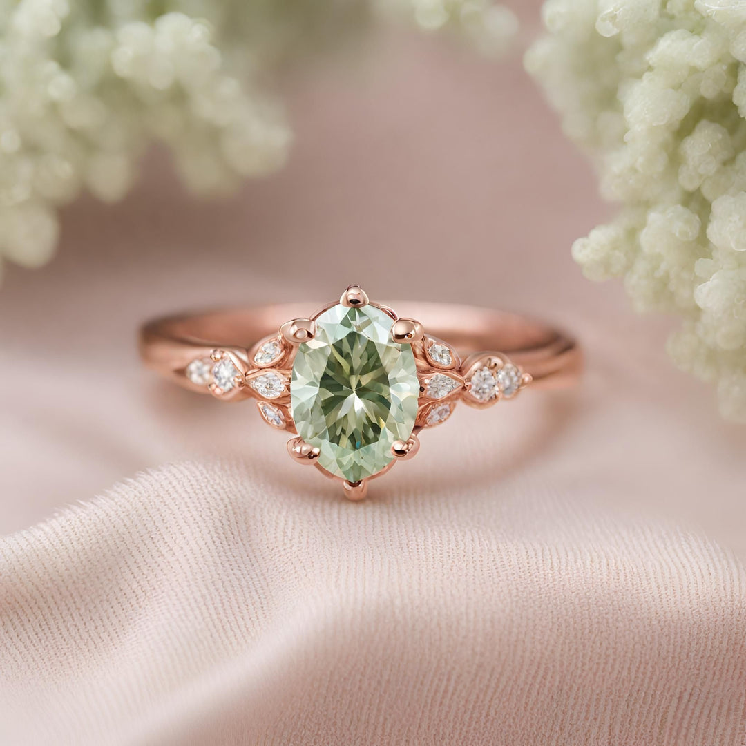 Light green Moissanite engagement ring, oval cut pastel green lab grown gemstone in rose gold from Rare Earth Jewelry.