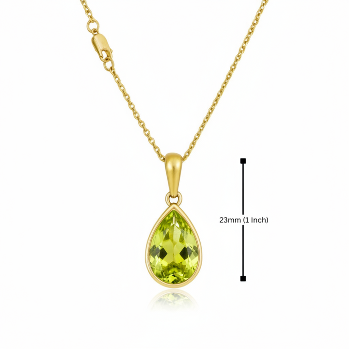 A pear cut natural Peridot pendant in a modern bezel set design, displaying the measurements and the lobster clasp | Rare Earth Jewelry