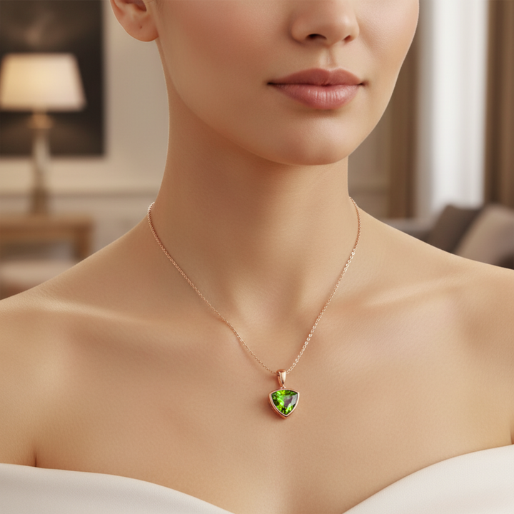 Model wearing natural peridot triangle pendant necklace in 14K rose gold, minimalist bezel set August birthstone | Rare Earth Jewelry