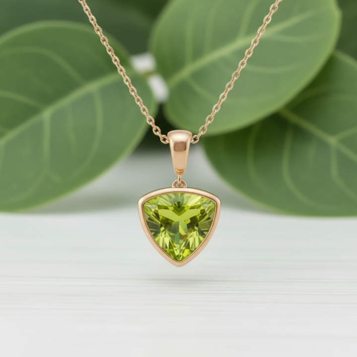 Trillion cut peridot pendant necklace in 14K rose gold, modern bezel set triangle design, natural green gemstone necklace | Rare Earth Jewelry