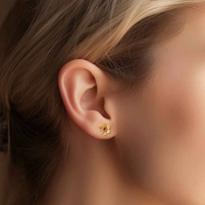 Pink tourmaline stud earrings in a  floral design. Flower shaped pink tourmaline earrings on the ear. Natural gemstone earrings in 14K or 18K Gold. October birthstone earrings. Perfect birthday gift or push present. | Rare Earth Jewelry