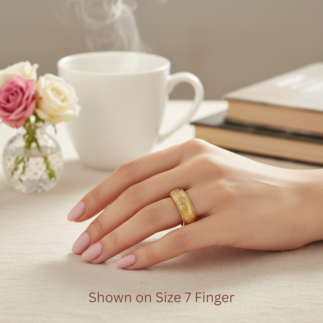 Engraved rose floral wedding band on the hand, botanical rose flower design ring, nature inspired wedding ring, 8mm wide band in 14K Yellow Gold | Rare Earth Jewelry