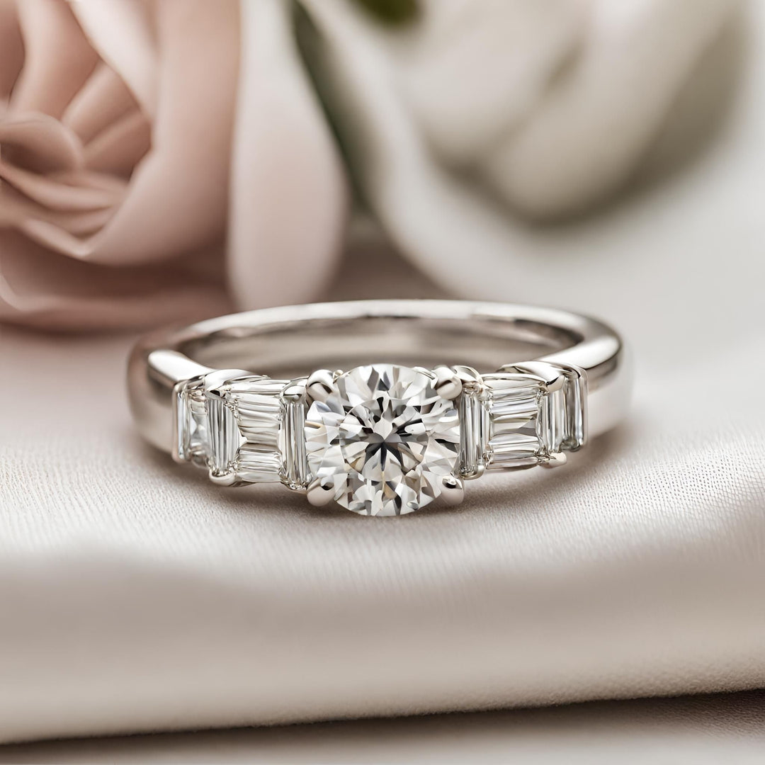 A round diamond engagement ring with baguettes in a modern bar set design from Rare Earth Jewelry.