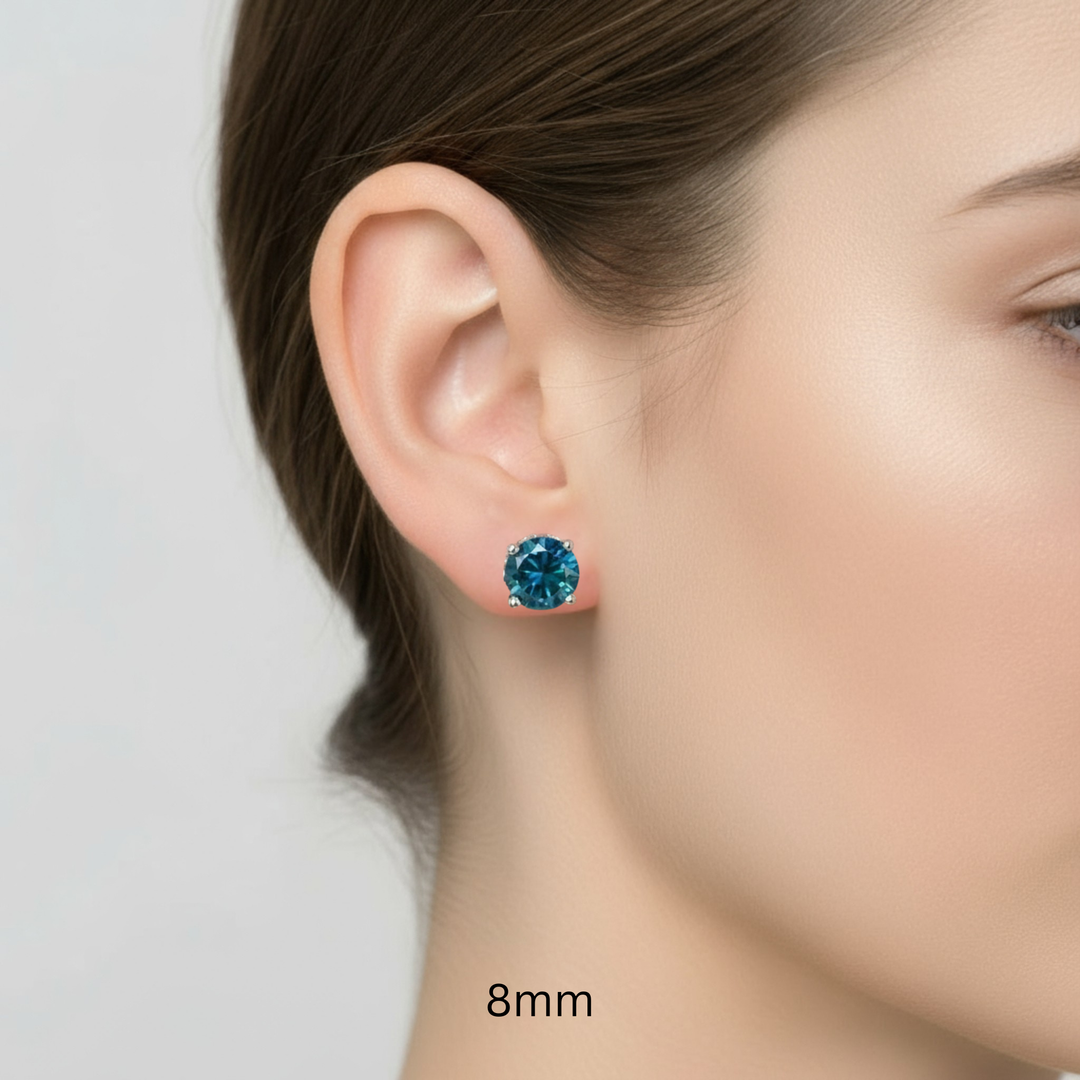 14K Gold London Blue Topaz Earrings, 8mm Natural Blue Topaz Studs Shown on the Ear, Round Blue Gemstone Earrings, December Birthstone Jewelry | Rare Earth Jewelry