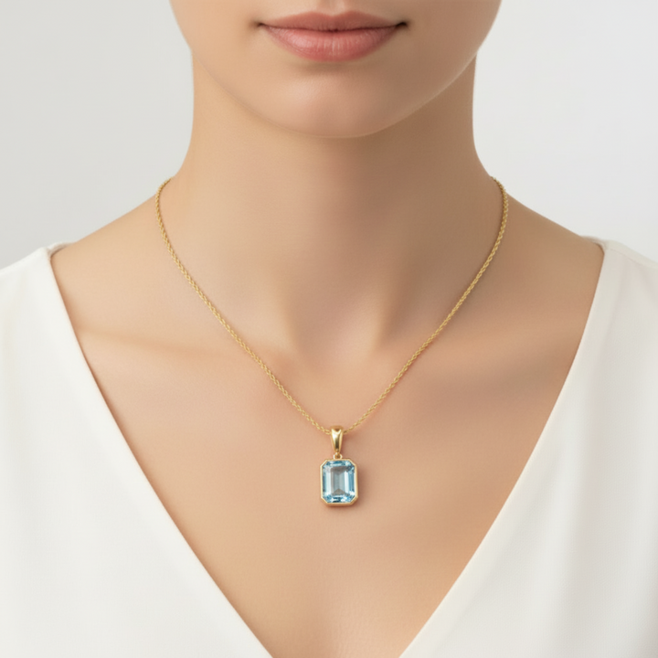 14K Gold Sky Blue Topaz Pendant on Model, December Birthstone Necklace with Natural Light Blue Gemstone | Rare Earth Jewelry