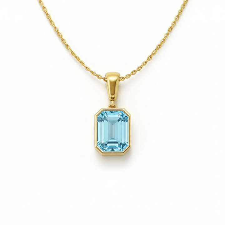 emerald cut sky blue topaz necklace in 14k yellow gold bezel setting light blue gemstone | Rare Earth Jewelry