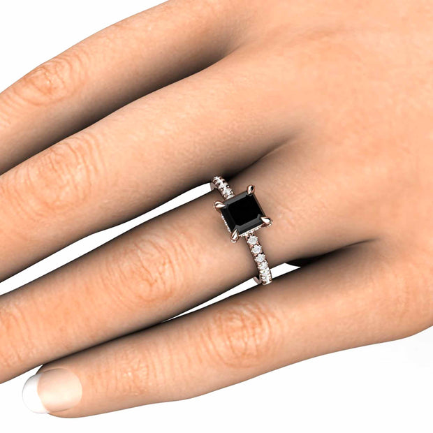 Square Black Diamond engagement ring with french pave diamonds and claw prongs shown on the hand.