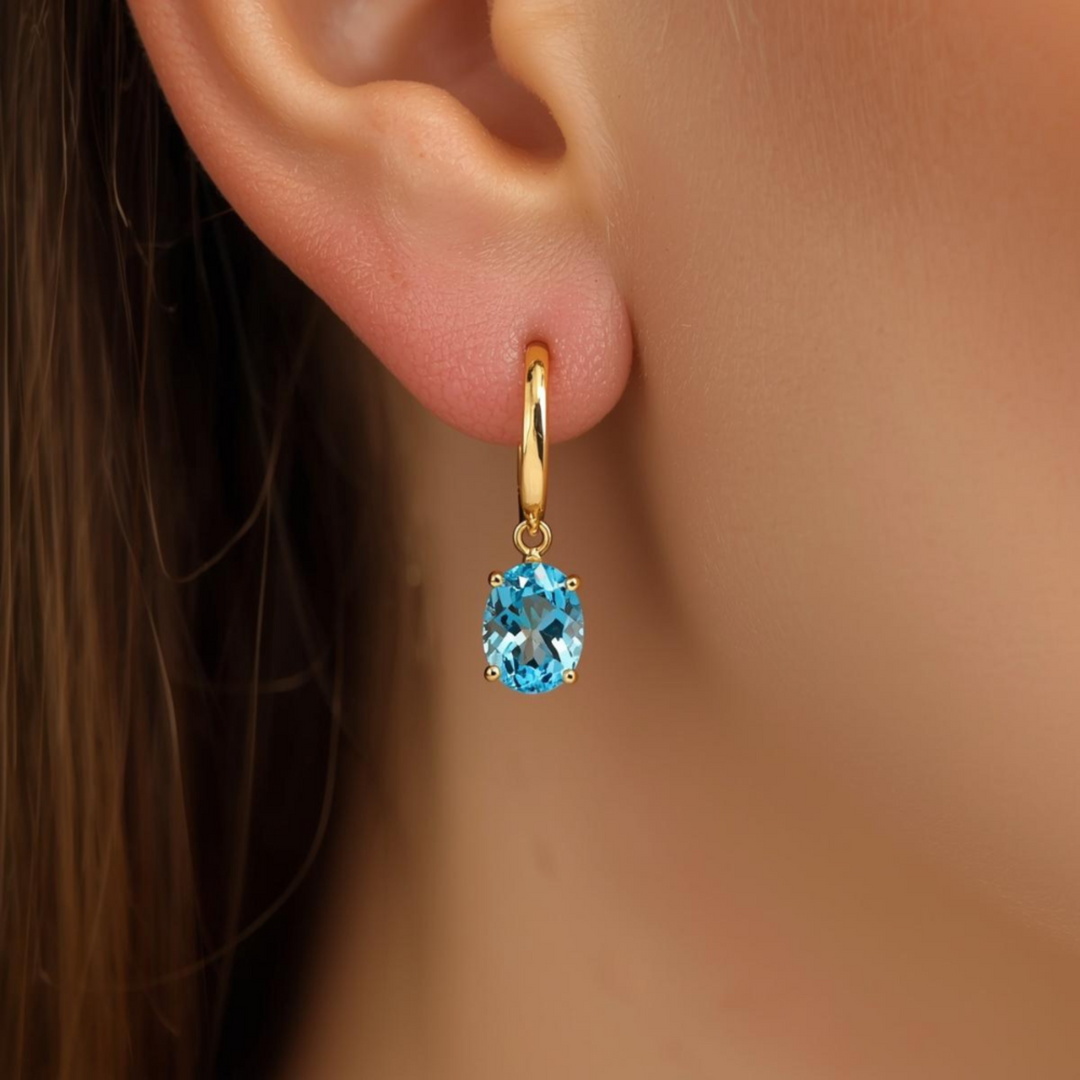 Natural Swiss Blue Topaz Drop Earrings in 14K Gold leverback settings, 8x6mm Oval Drops Shown on the Ear | Rare Earth Jewelry