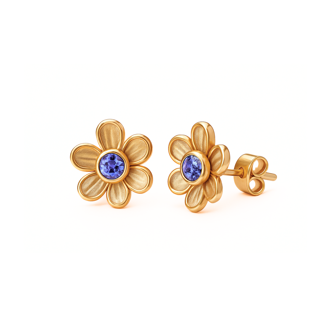 Tanzanite stud earrings in a dainty floral design, shown in yellow gold. 14K or 18K Gold natural gemstone earrings. Flower shaped December birthstone earrings. Perfect push present or birthday gift.  | Rare Earth Jewelry