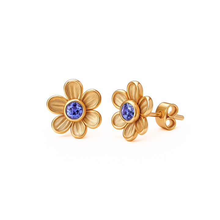 Tanzanite stud earrings in a dainty floral design, shown in yellow gold. 14K or 18K Gold natural gemstone earrings. Flower shaped December birthstone earrings. Perfect push present or birthday gift.  | Rare Earth Jewelry