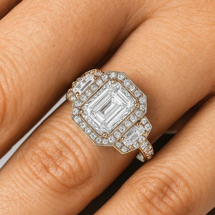 Three Stone Moissanite Engagement Ring Close Up of Ring on Finger, Emerald Cut Moissanite Halo Ring on Hand | Rare Earth Jewelry