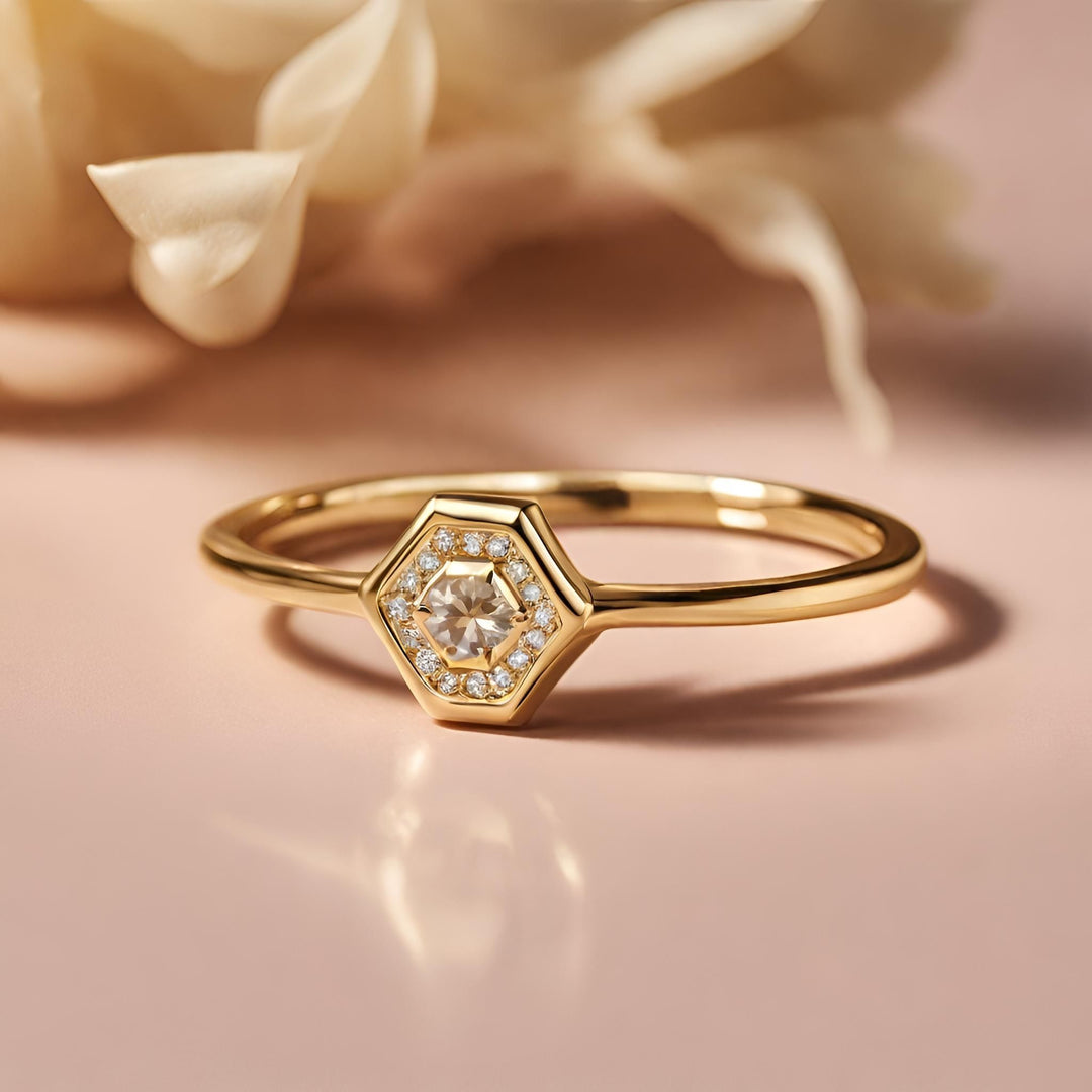 A small diamond engagement ring or right hand ring with a geometric hexagon shape modern minimalist style from Rare Earth Jewelry.