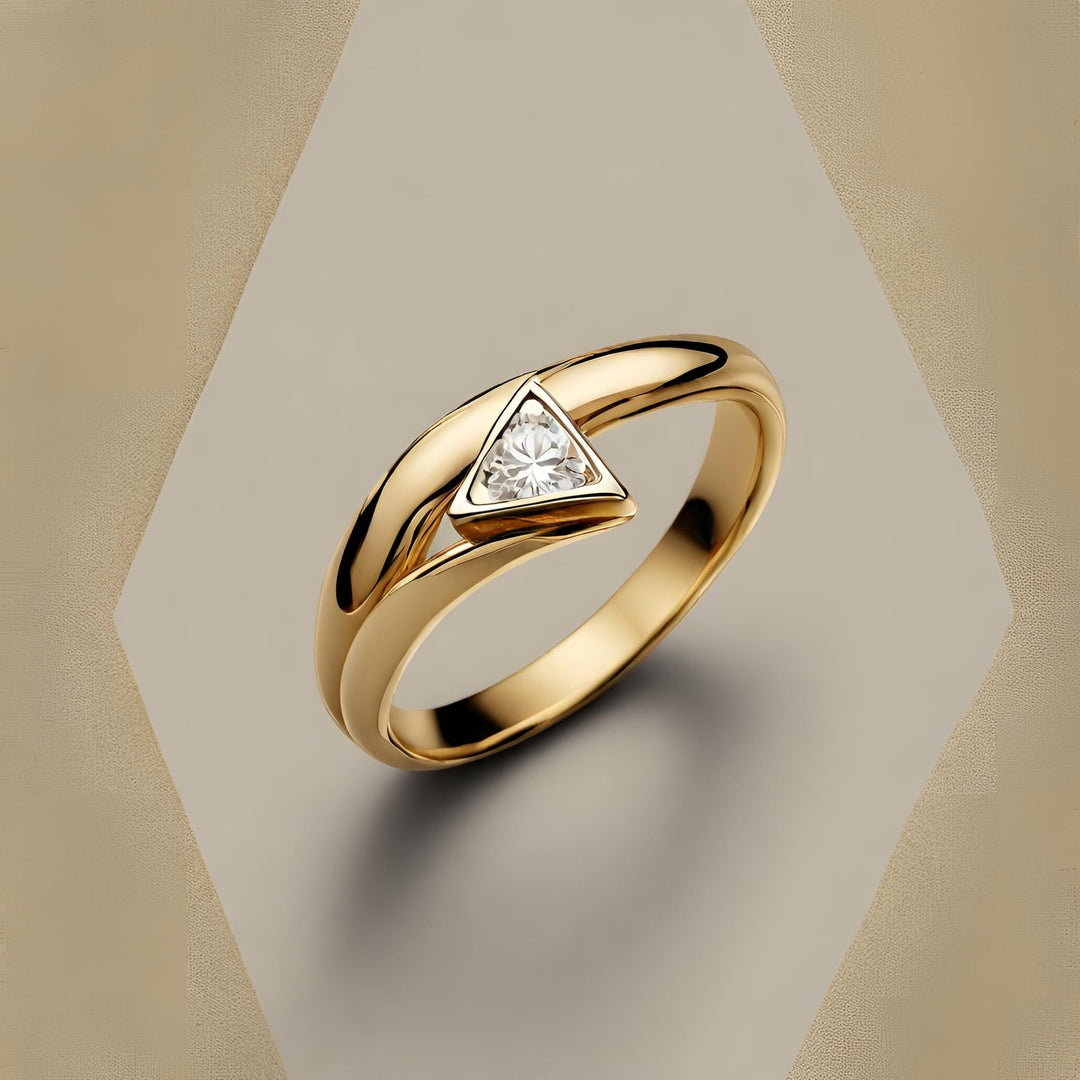 A unique triangle-shaped diamond ring in an 18K Gold modern bezel set bypass design from Rare Earth Jewelry.