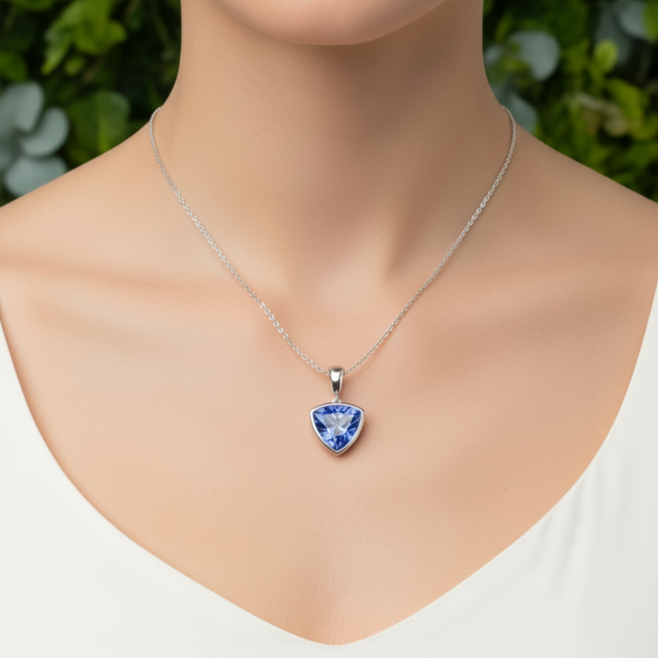 Trillion cut cornflower blue sapphire necklace on model, 14K white gold sapphire pendant | Rare Earth Jewelry