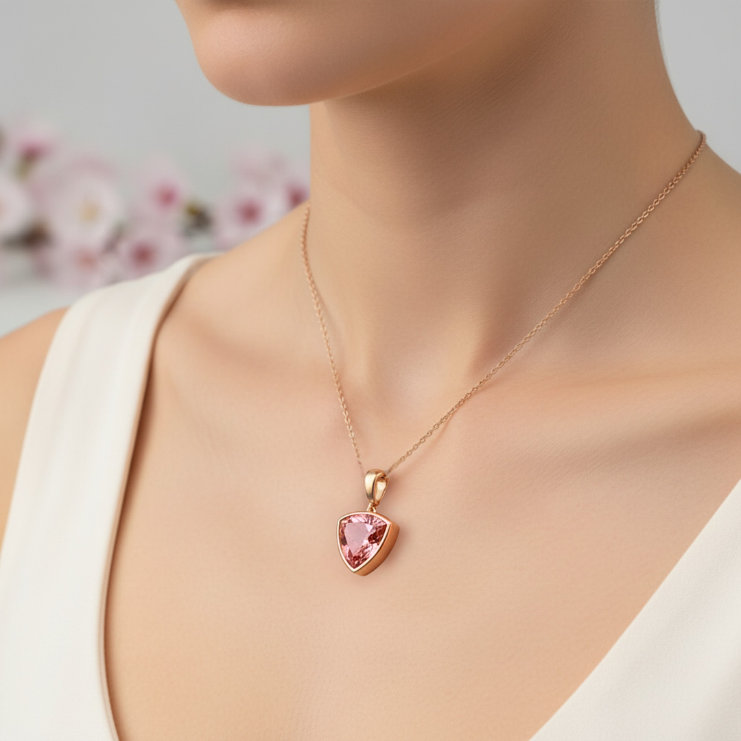 Padparadscha Pink Sapphire Trillion Necklace on Model in 14K Gold Bezel Setting | Rare Earth Jewelry