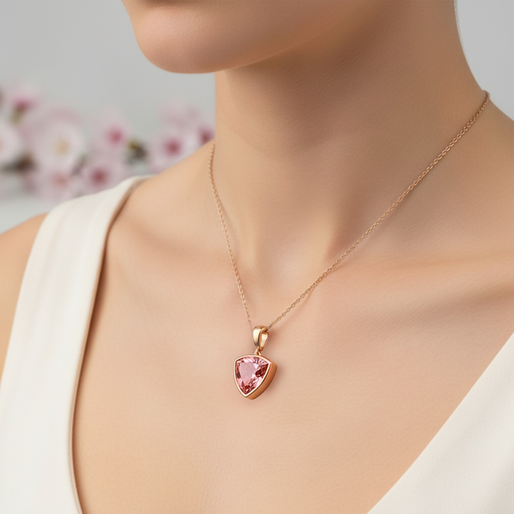Padparadscha Pink Sapphire Trillion Necklace on Model in 14K Gold Bezel Setting | Rare Earth Jewelry