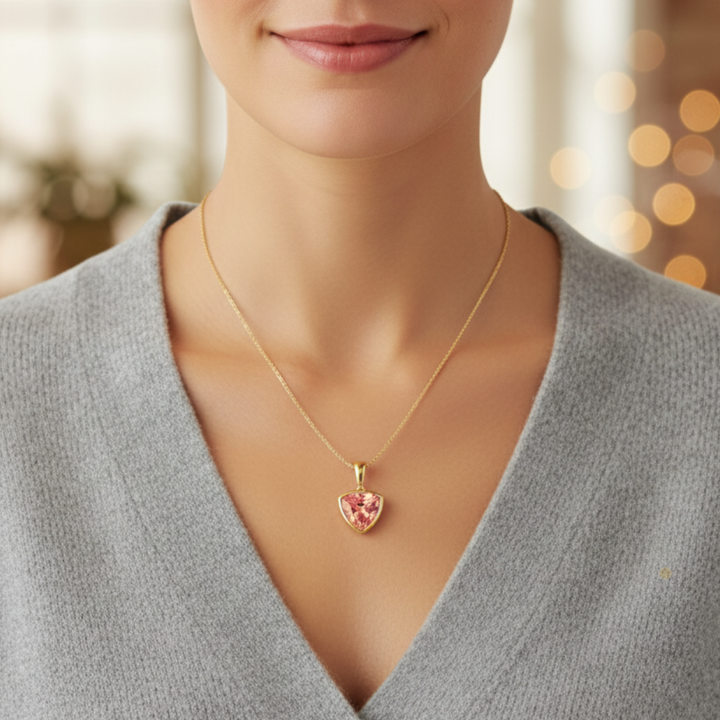 Modern Padparadscha Sapphire Necklace Worn on Model, Peach Pink Gemstone Pendant | Rare Earth Jewelry